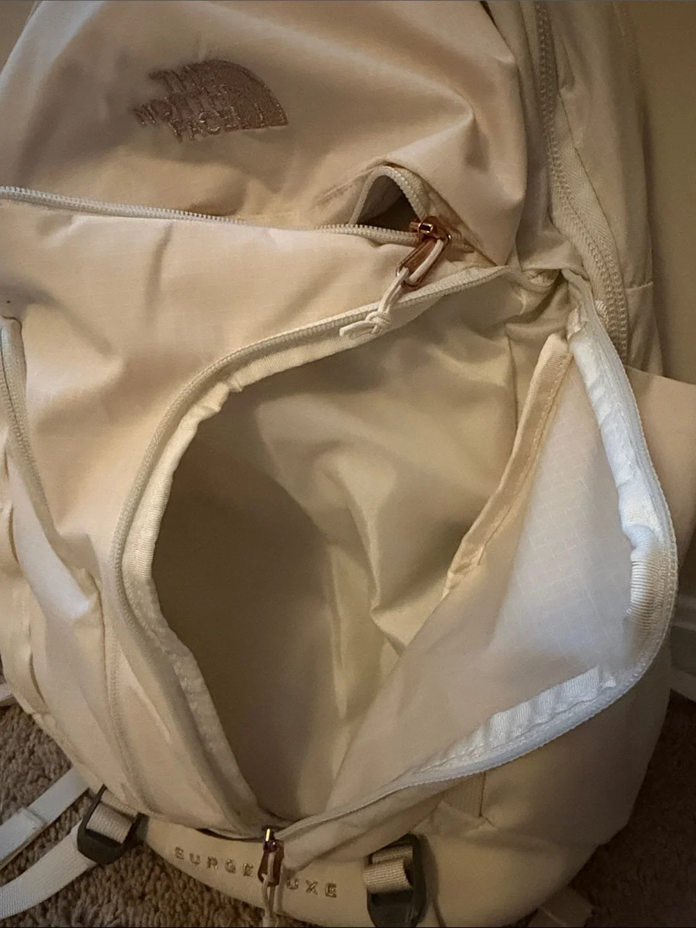 The North Face Surge Lux Backpack in Cream with Rose Gold(good as new 90%)